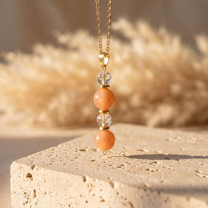 Pendentif "Aube Claire" en Pierre de Soleil et Cristal de Roche