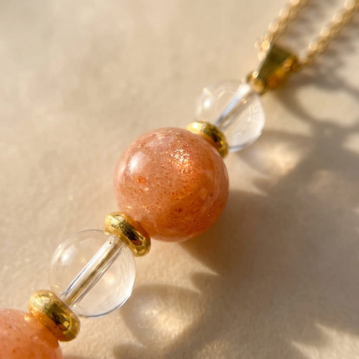 Pendentif "Aube Claire" en Pierre de Soleil et Cristal de Roche