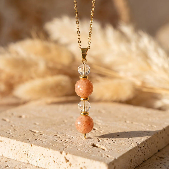Pendentif "Aube Claire" en Pierre de Soleil et Cristal de Roche